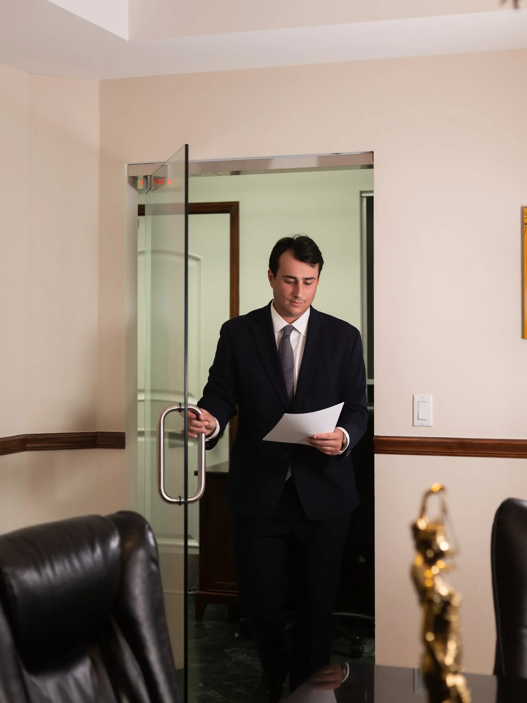 Andres Vega entering the conference room of his Miami Lakes office